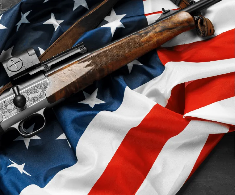 Firearms resting on an American flag
